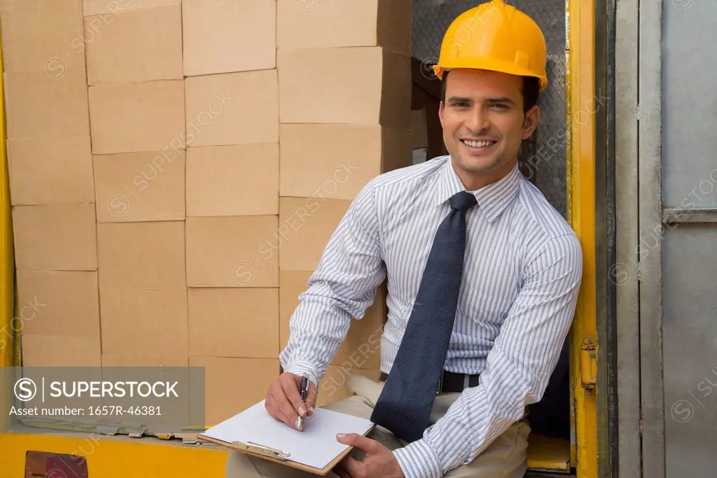 Man doing inventory and smiling
