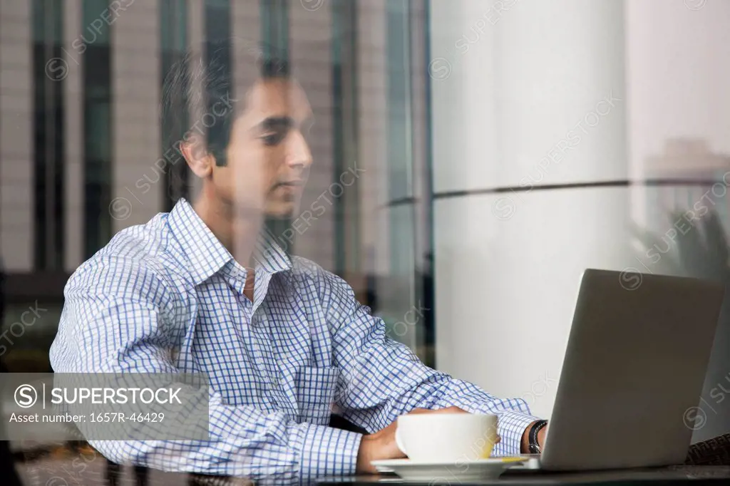 Businessman working on a laptop in his office