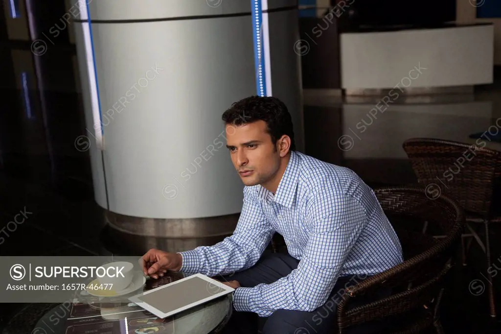 Businessman sitting in his office and thinking