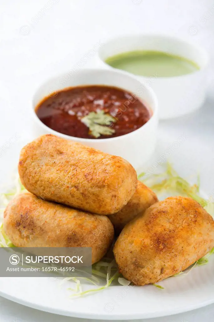 Aloo Cheese Croquettes served in a plate with sauce