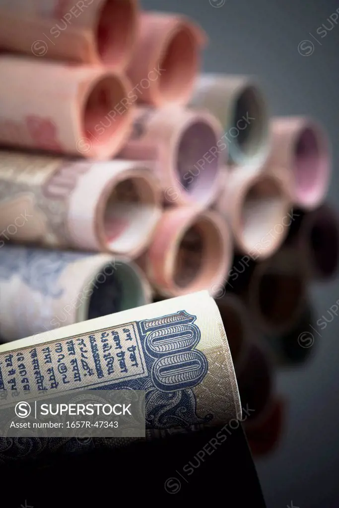 Close-up of rolled-up Indian paper currency