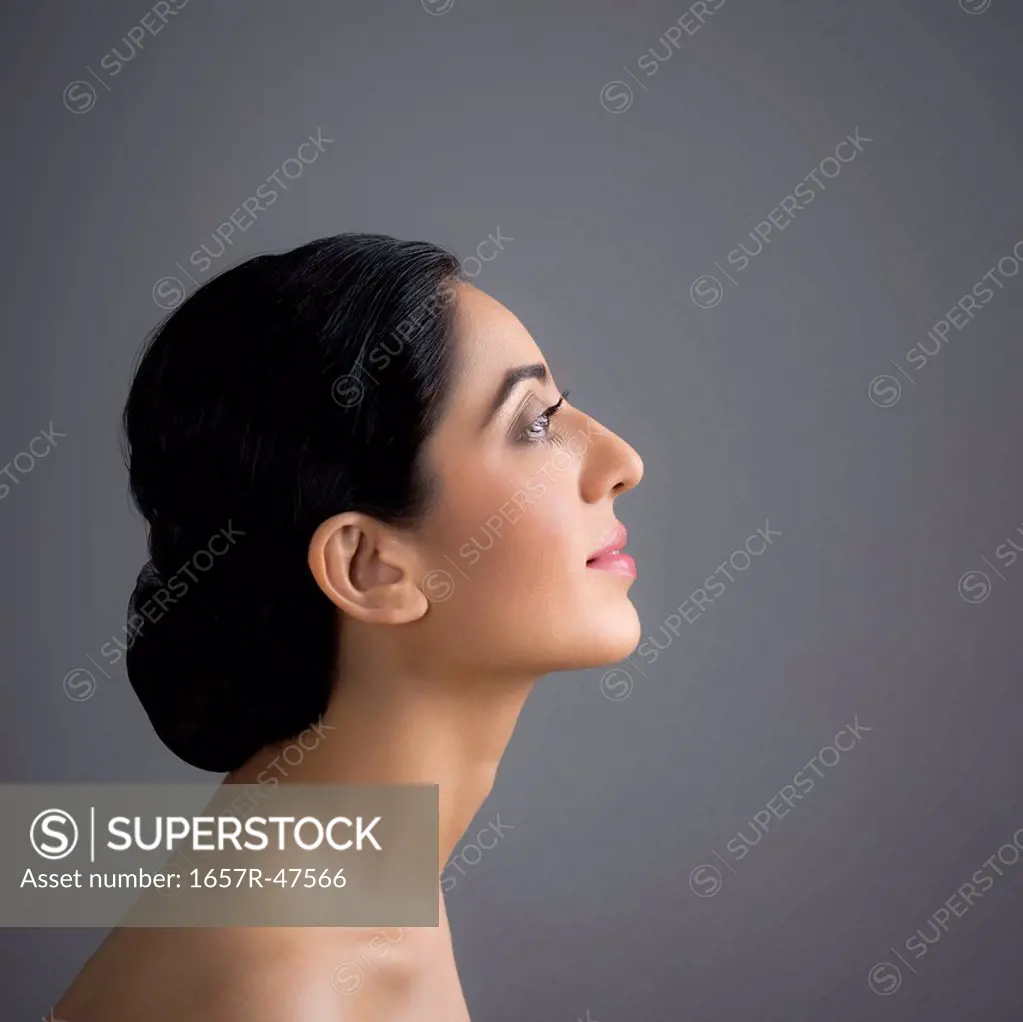 Close-up of beautiful woman looking away