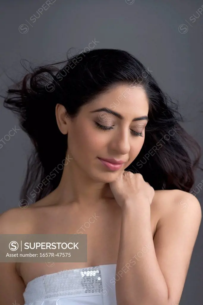 Close-up of a beautiful woman with her eyes closed