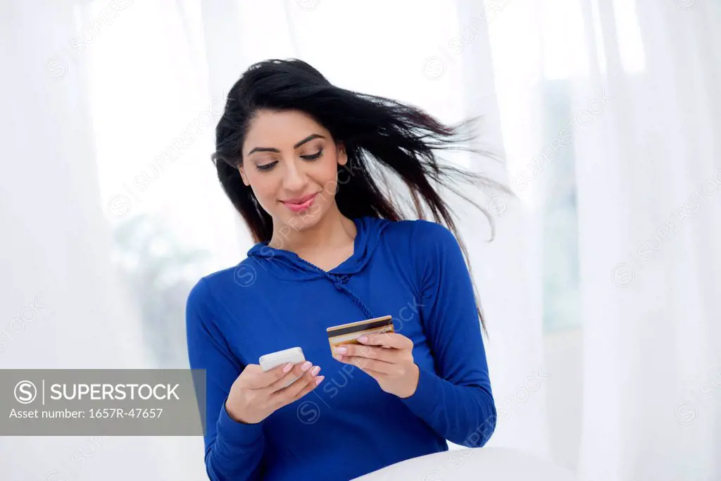 Woman doing online shopping with a credit card