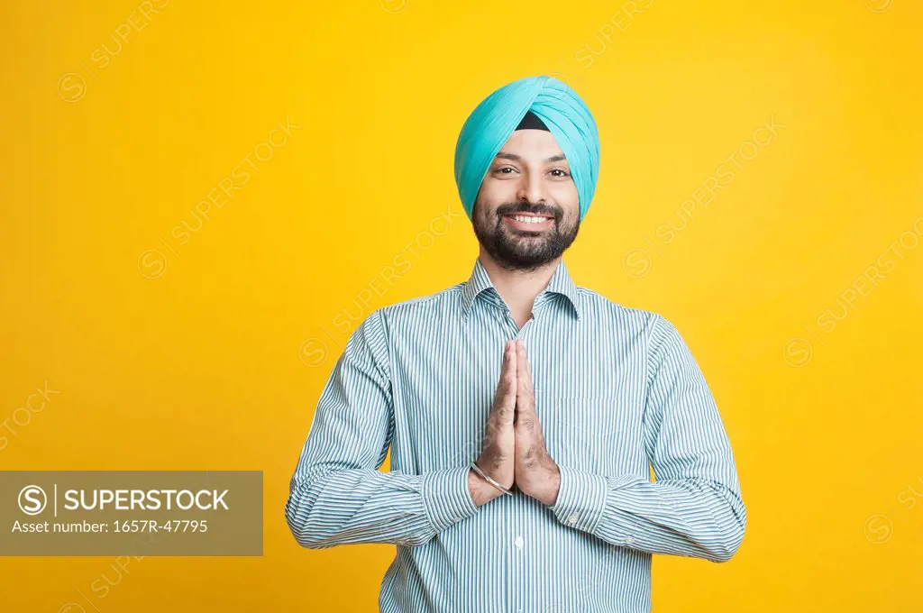 Portrait of a Sikh man greeting with smile
