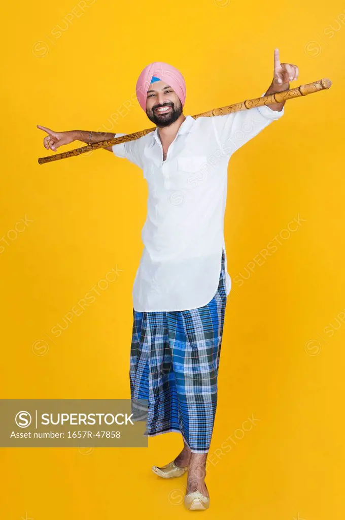 Sikh man doing bhangra dance