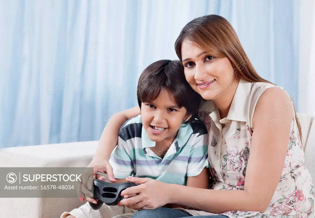 Woman playing video game with her son