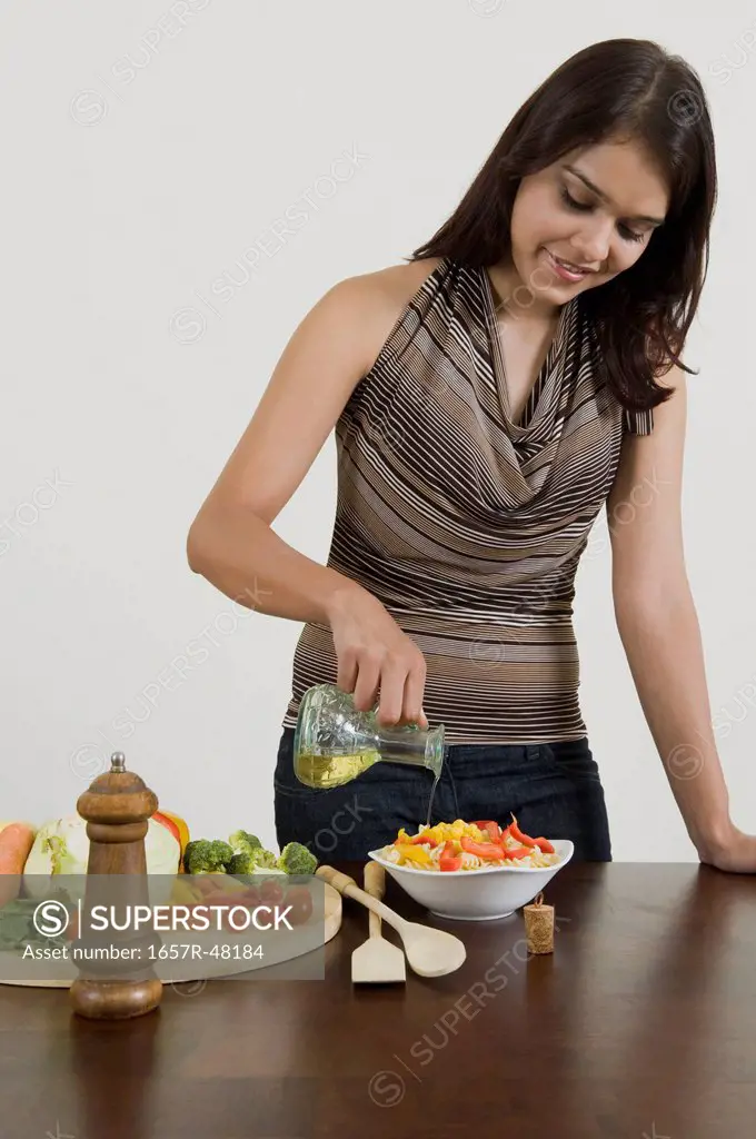 Woman preparing pasta in the kitchen