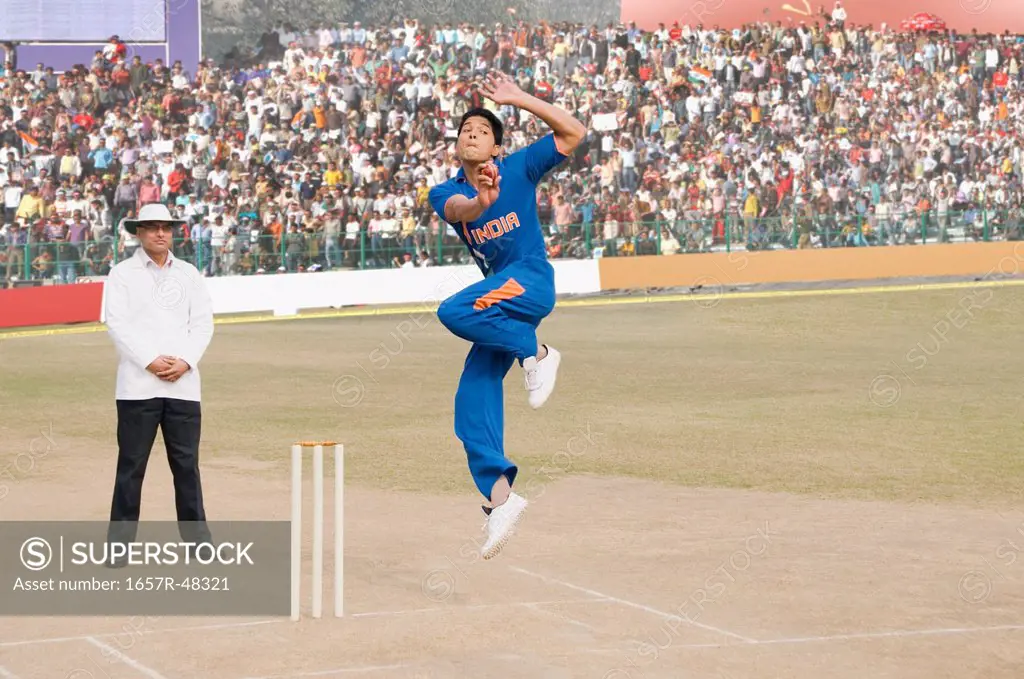 Cricket bowler in action