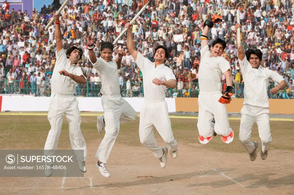 Cricket players jumping in excitement