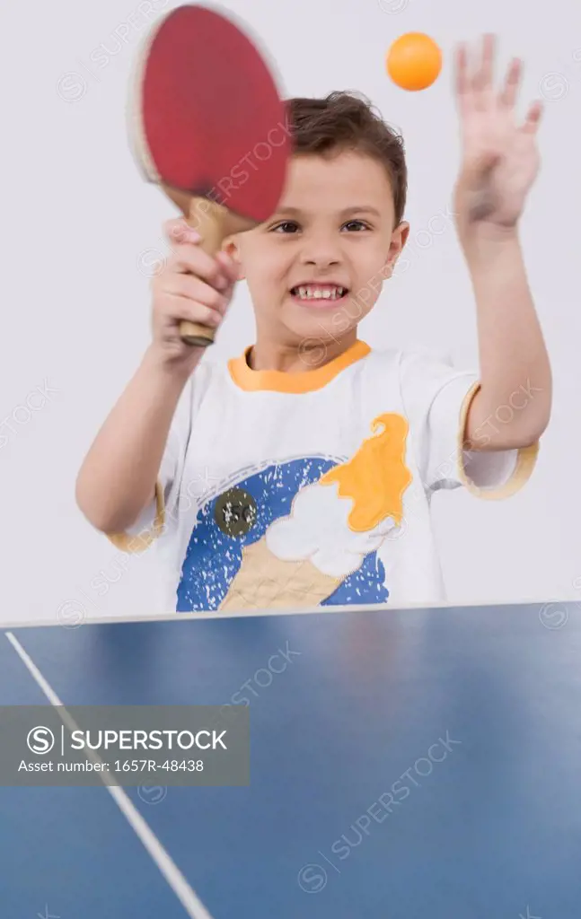 Boy playing table tennis