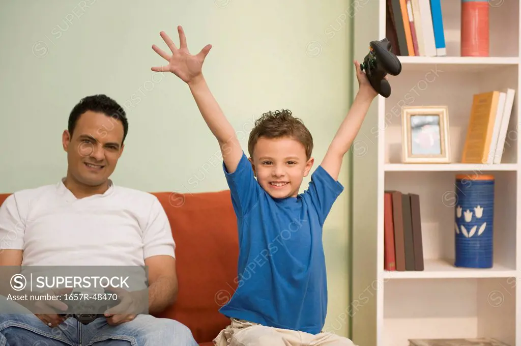 Man and his son playing a video game
