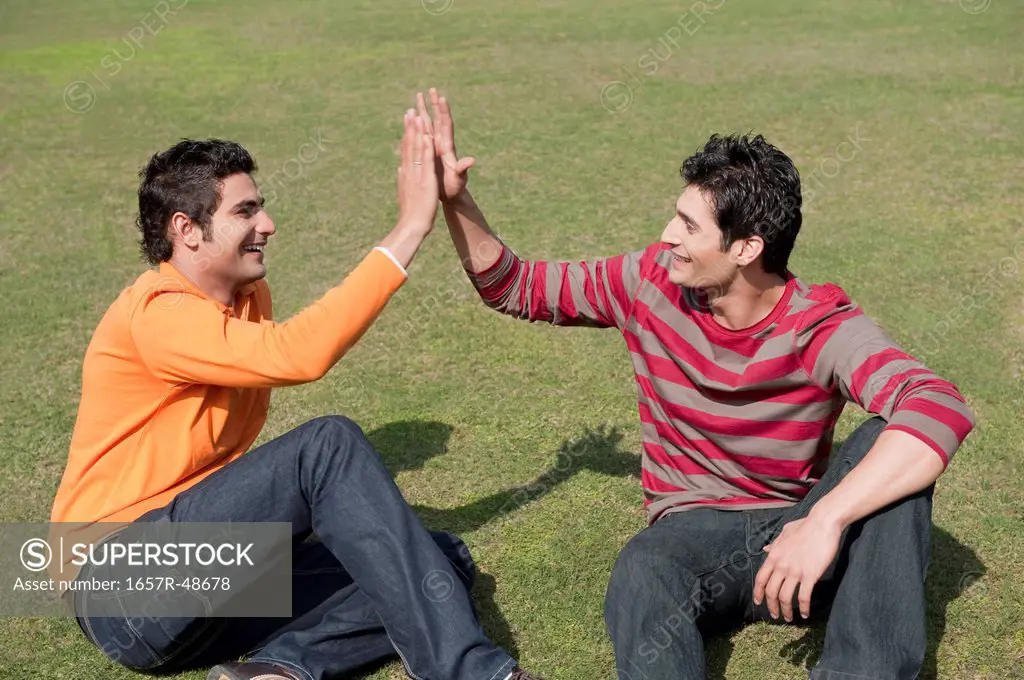 Friends giving high-five to each other