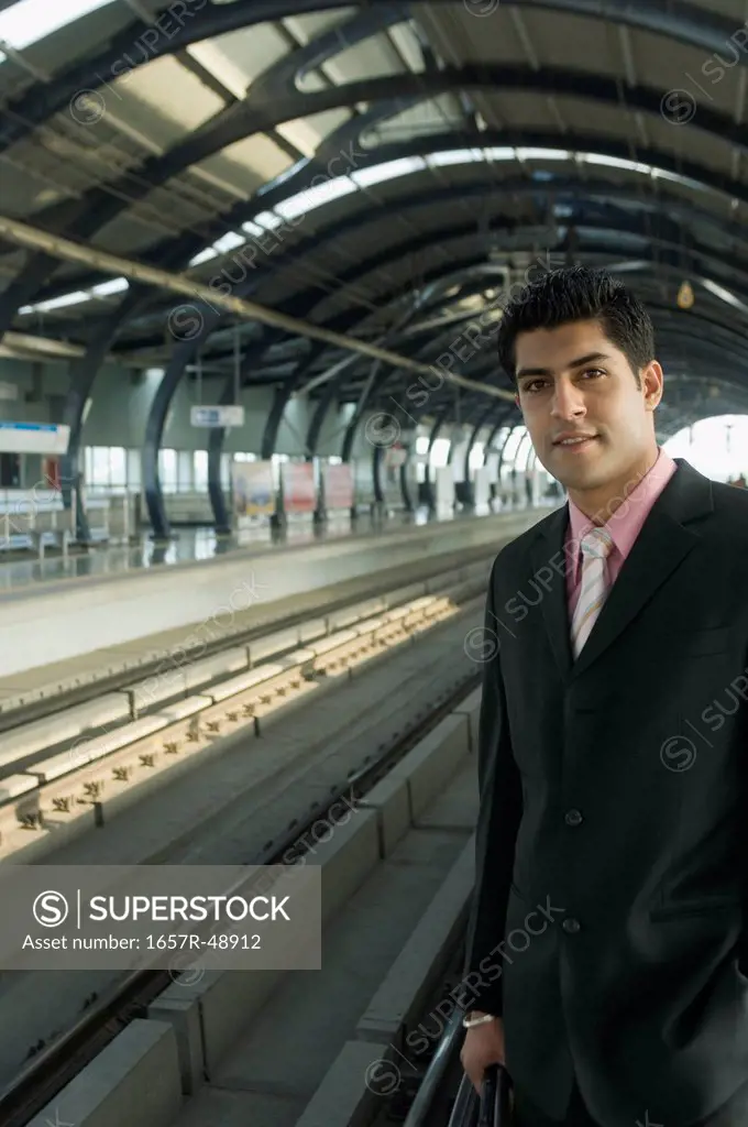 Businessman at a subway station, Dwarka, New Delhi, India
