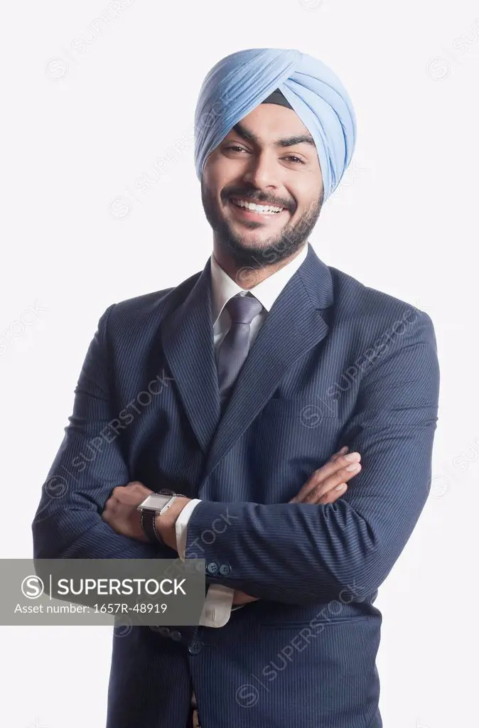 Businessman smiling with arms crossed