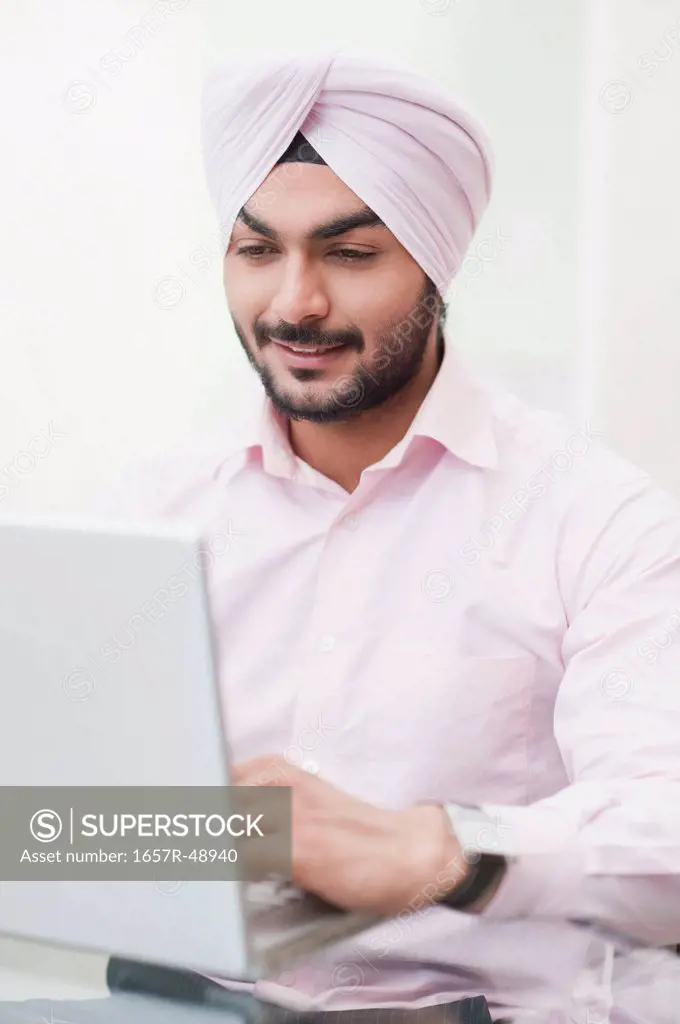 Businessman working on a laptop at home