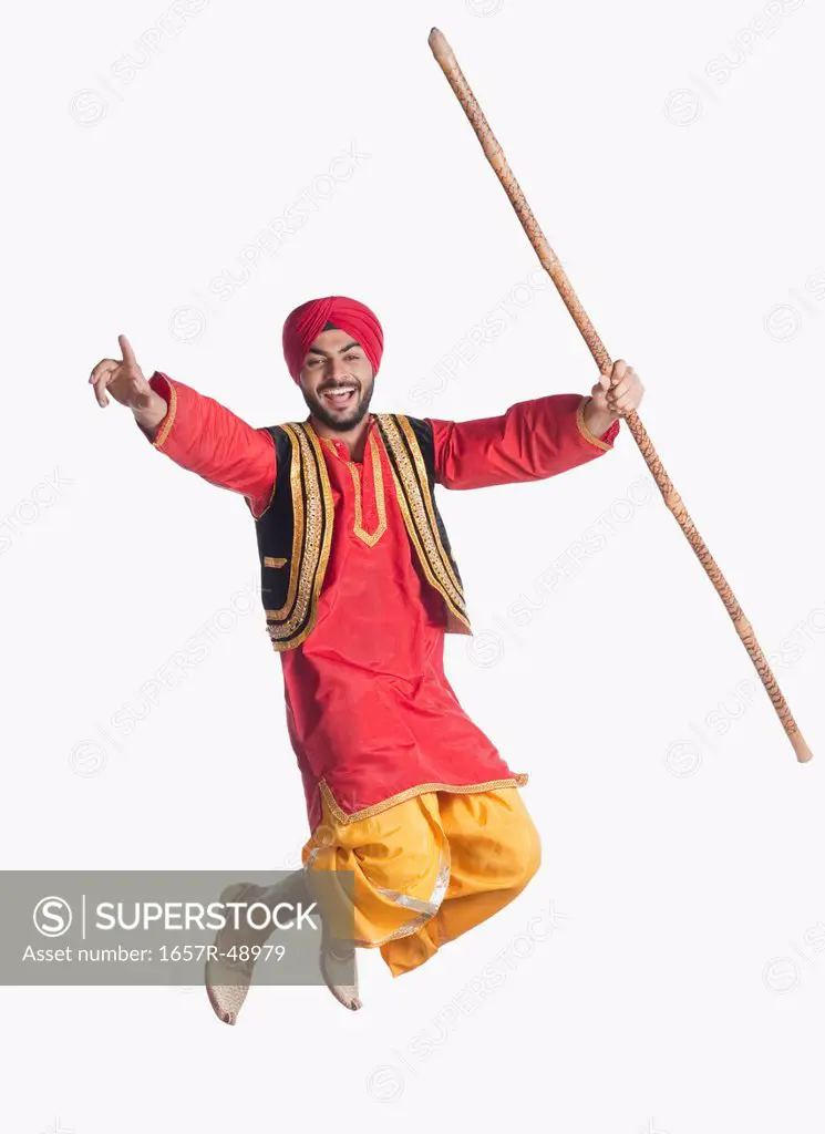 Man doing Bhangra the folk dance of Punjab in India