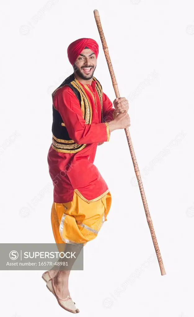 Man doing Bhangra the folk dance of Punjab in India