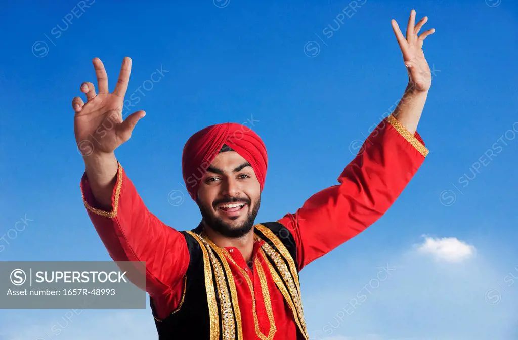 Man doing Bhangra the folk dance of Punjab in India, Gurgaon, Haryana, India