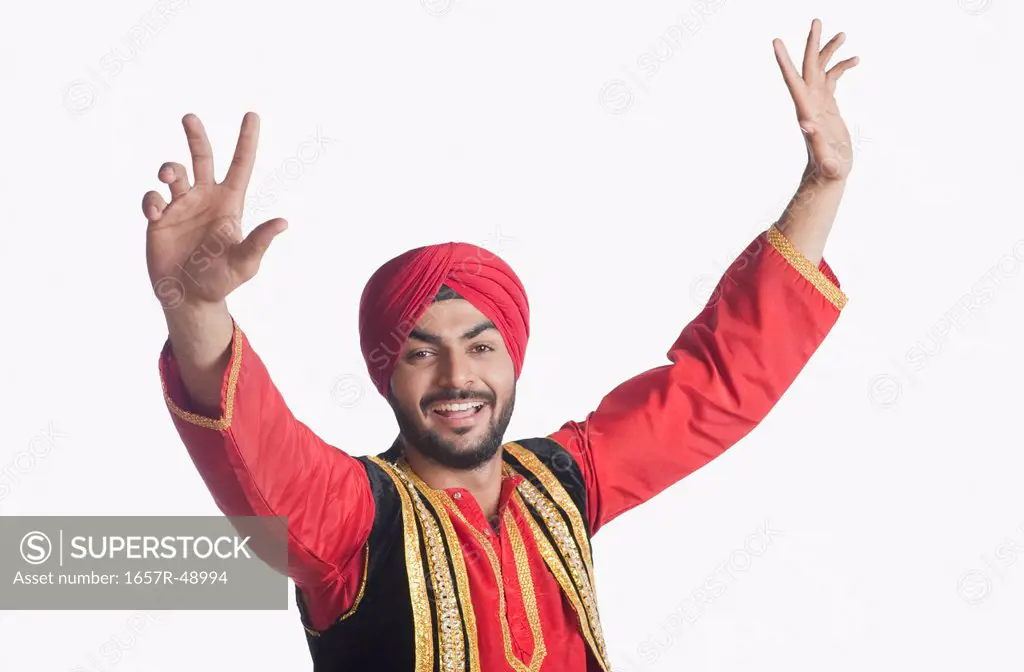 Man doing Bhangra the folk dance of Punjab in India