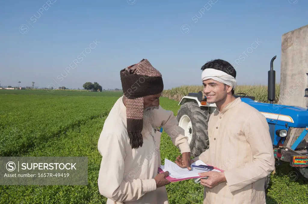 Farmer giving his thumbprint on the agreement of agriculture loan, Sonipat, Haryana, India