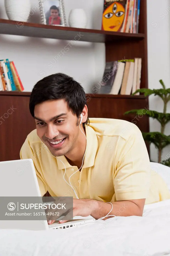 Bengali man using a laptop