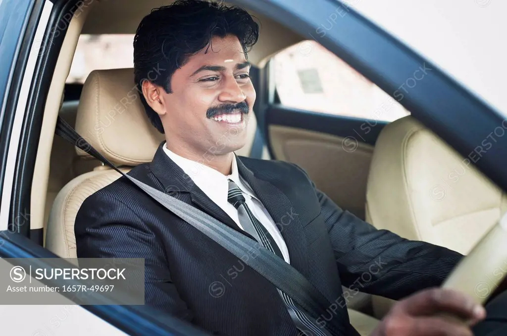 South Indian businessman driving the car