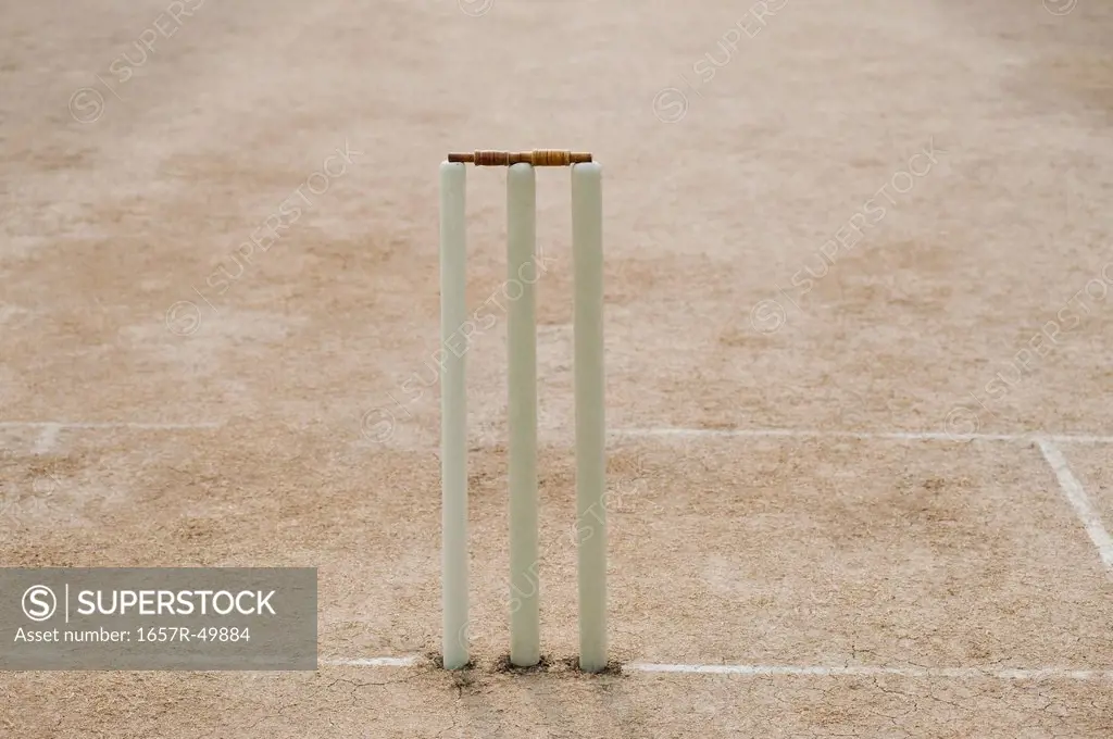 Cricket stumps on the playing field