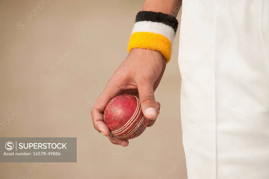 Cricket bowler holding a ball