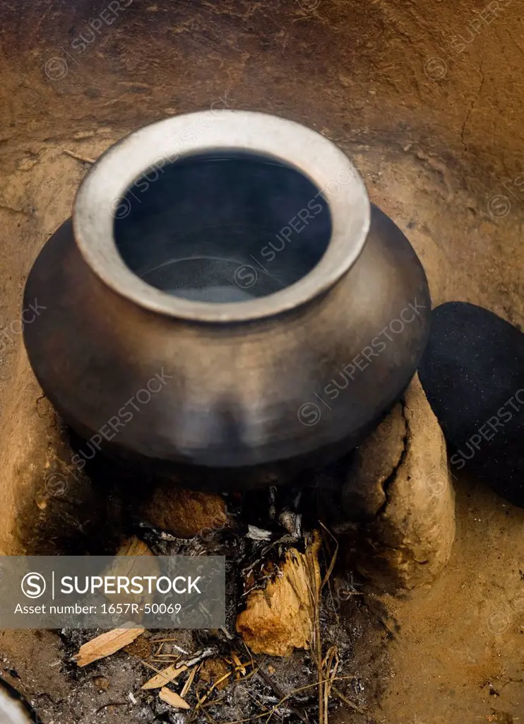 Utensil on a wood burning stove, Farrukh Nagar, Gurgaon, Haryana, India