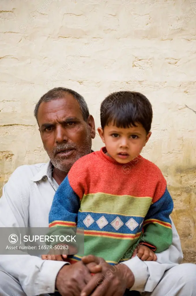 Portrait of a boy with his grandfather, Hasanpur, Haryana, India