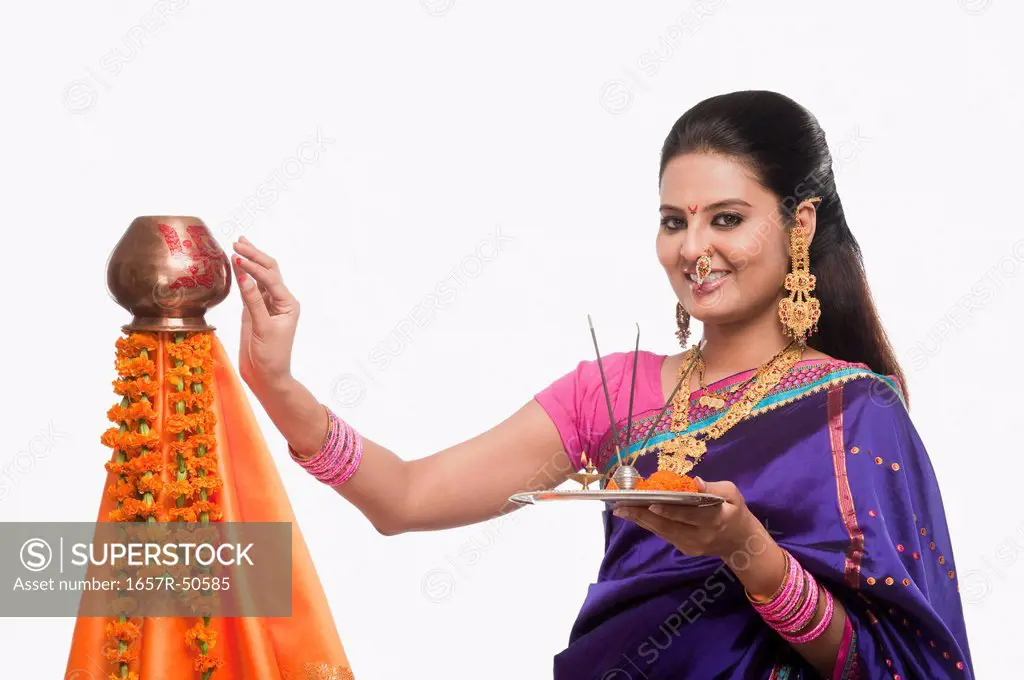 Portrait of a woman making a religious offerings on Gudi Padwa festival