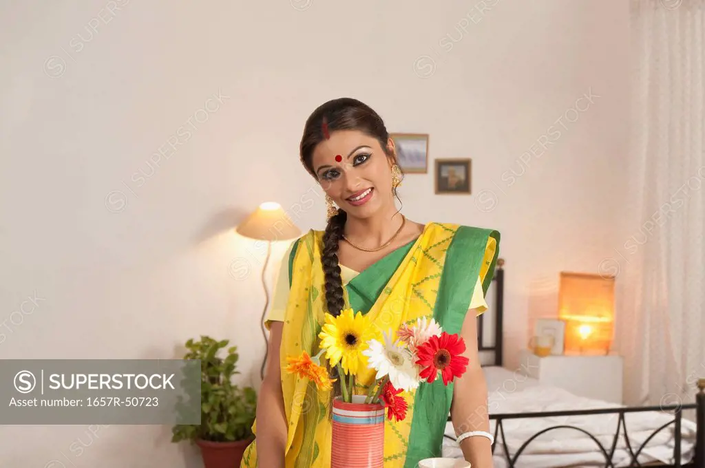 Bengali woman smiling in the bedroom