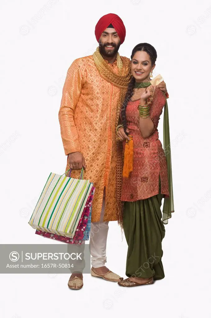 Sikh couple holding shopping bags