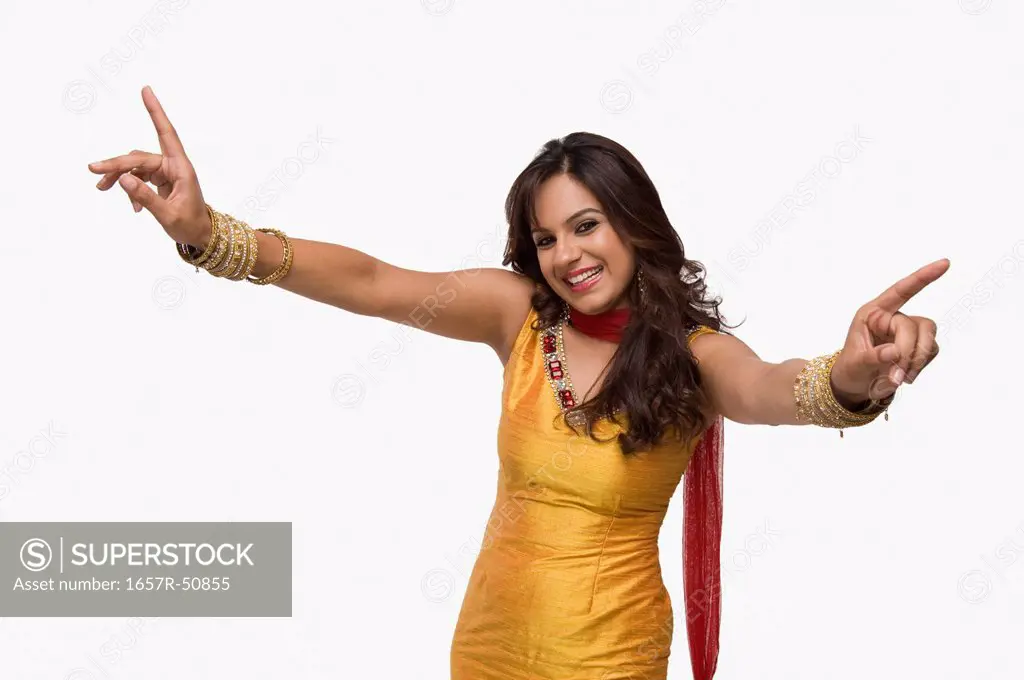 Portrait of a woman doing Bhangra the folk dance of Punjab in India
