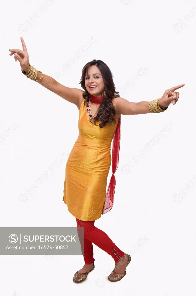 Portrait of a woman doing Bhangra the folk dance of Punjab in India