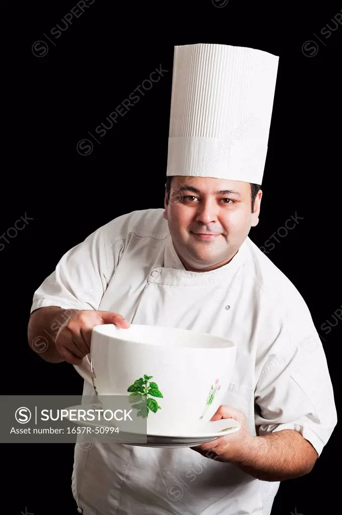 Chef holding an oversized cup