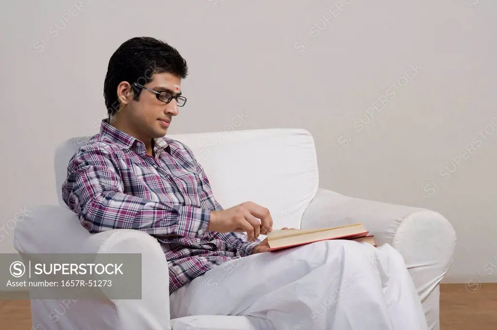 University student reading a book