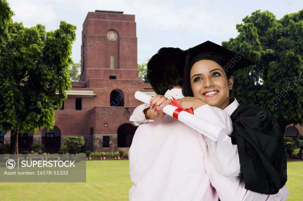 University student hugging her father