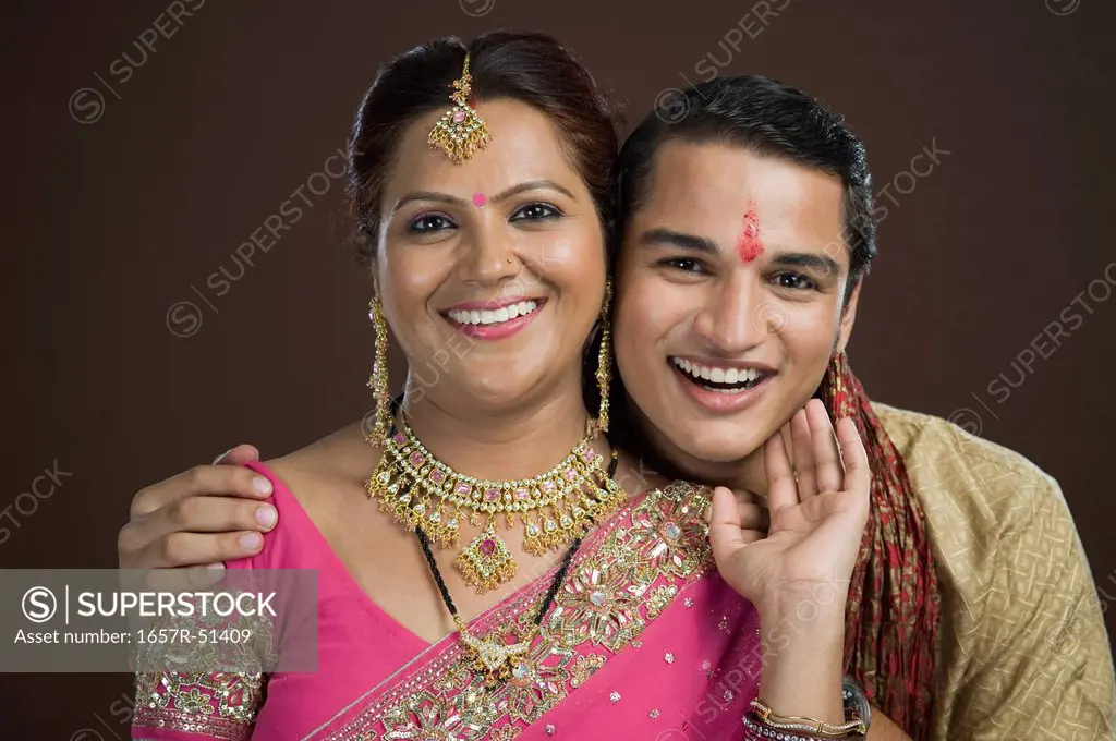 Portrait of a man and his mother smiling