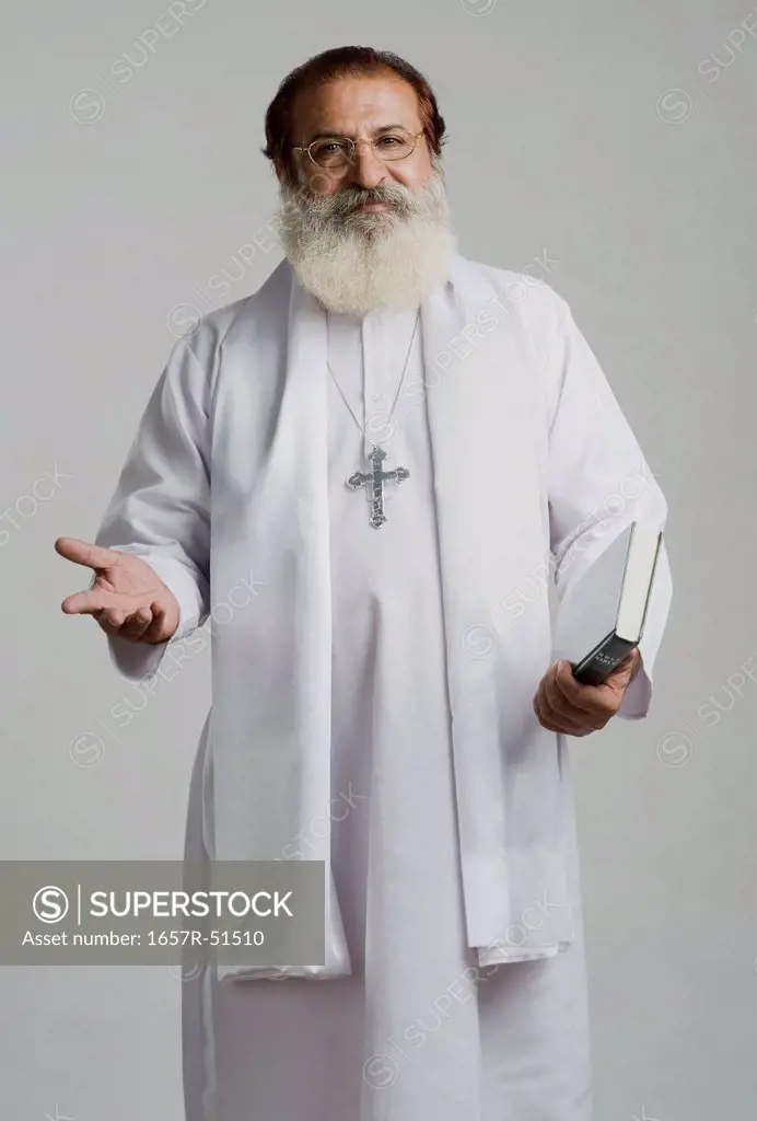 Portrait of a priest gesturing