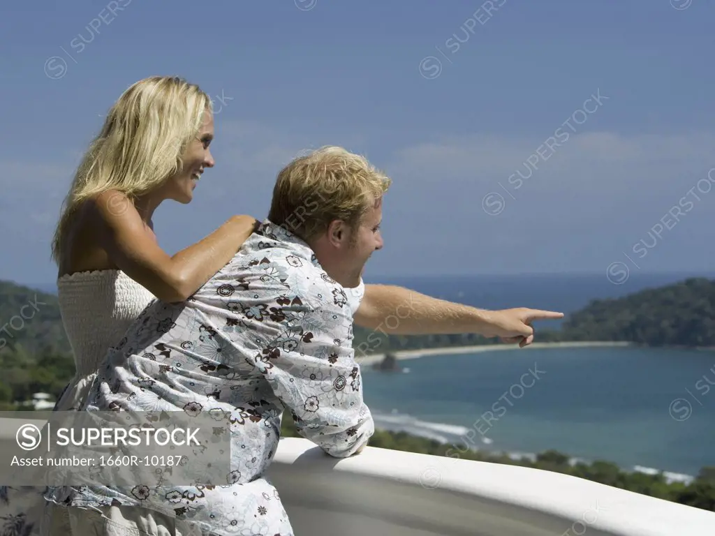Profile of a man and woman on a balcony