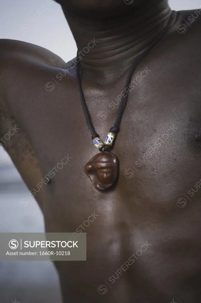 Mid section view of a man wearing a necklace