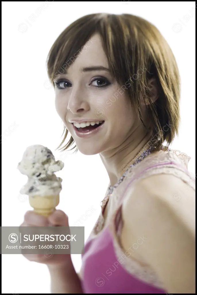 Portrait of a teenage girl holding an ice-cream cone