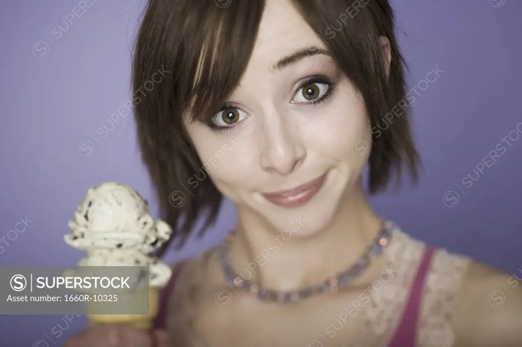 Portrait of a teenage girl holding an ice-cream cone
