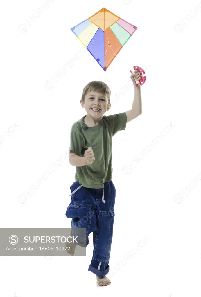 Portrait of a boy flying a kite