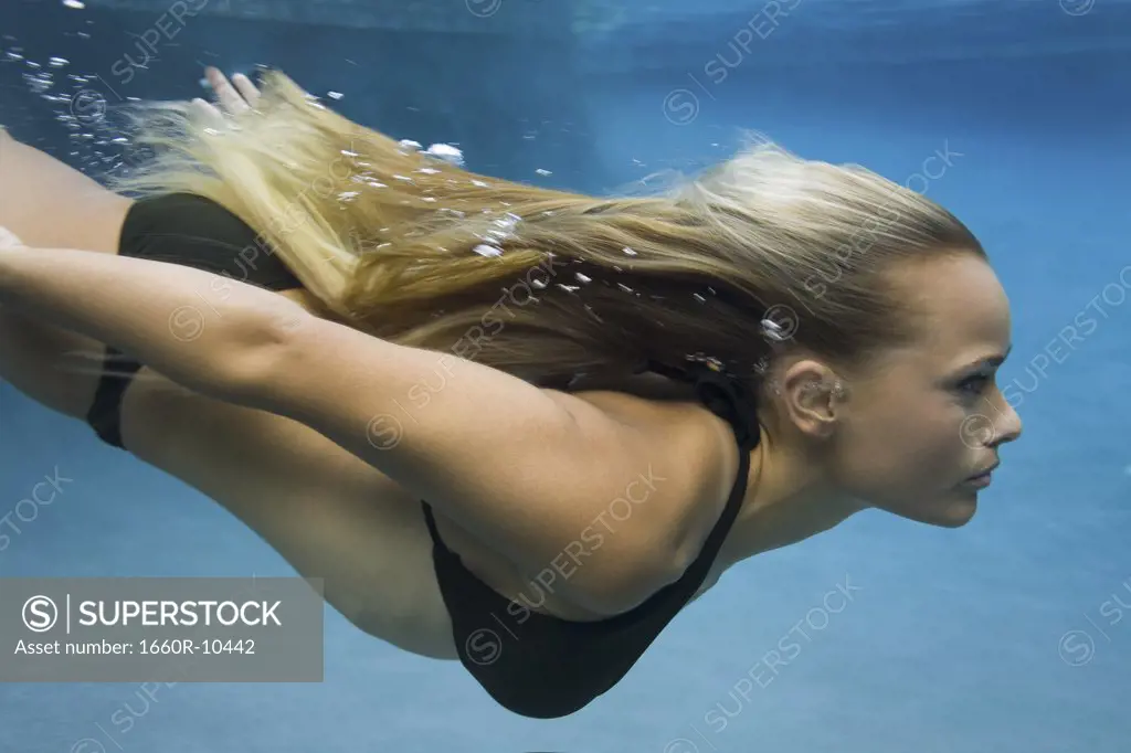 Profile of a teenage girl swimming