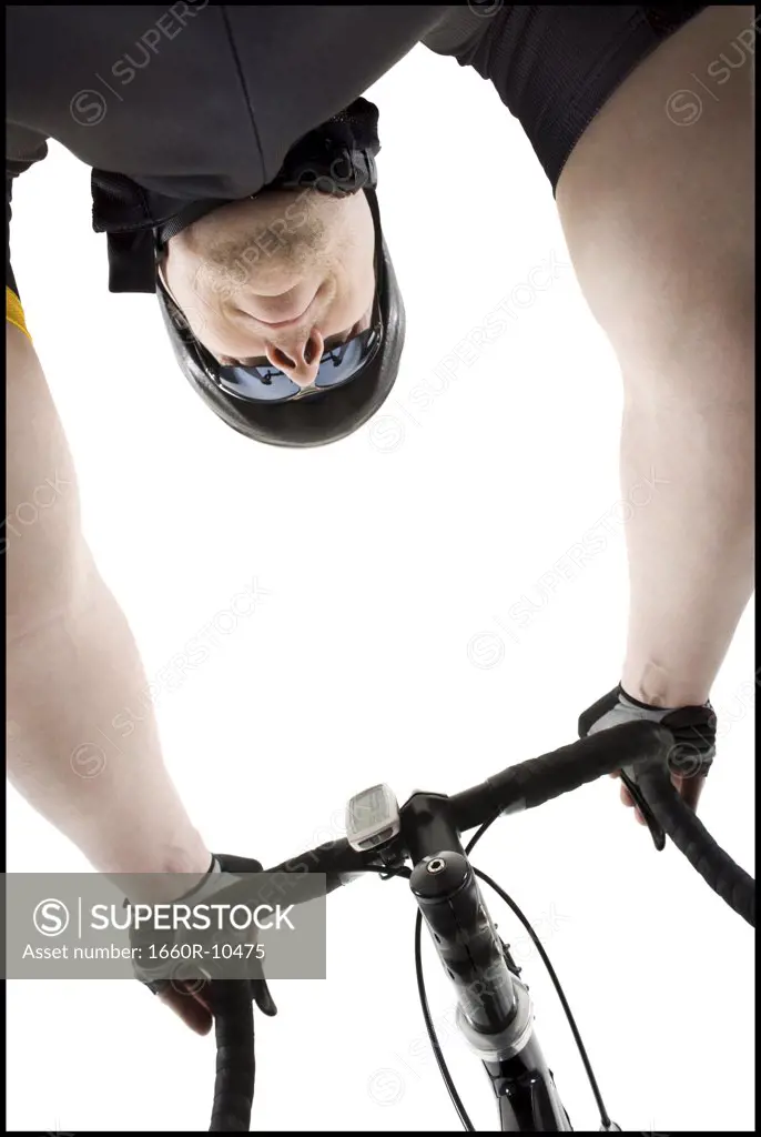 Low angle view of a mature man cycling
