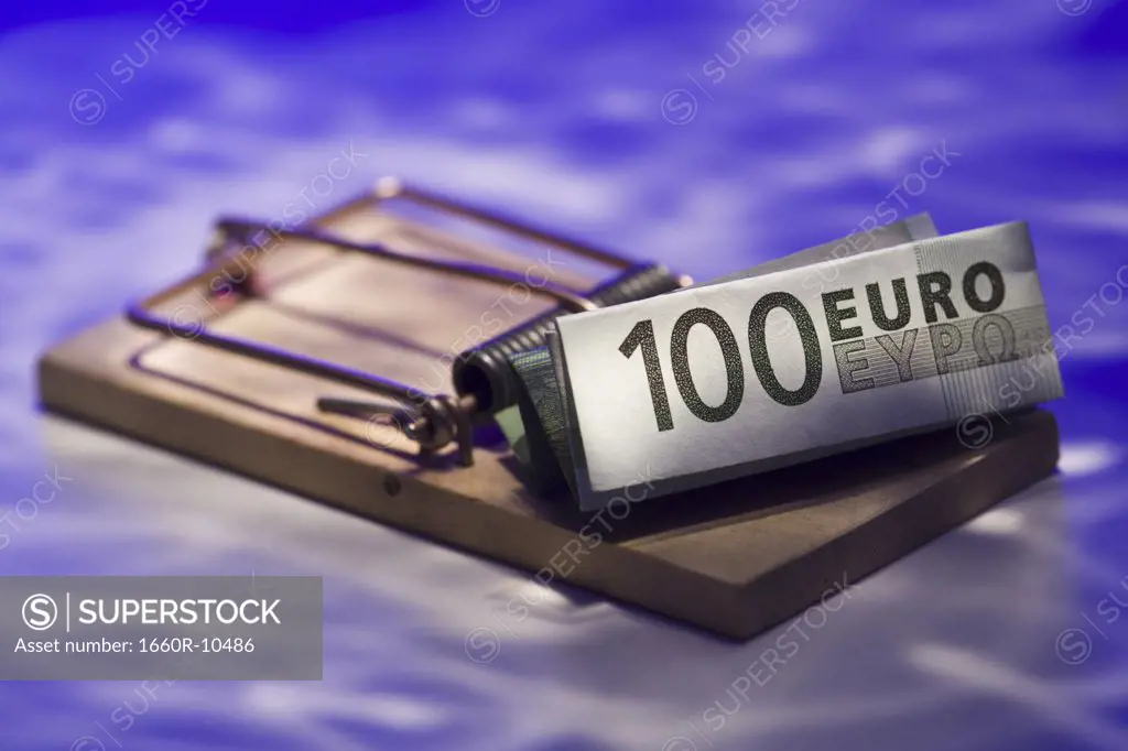 Close-up of Euro banknote on a mousetrap