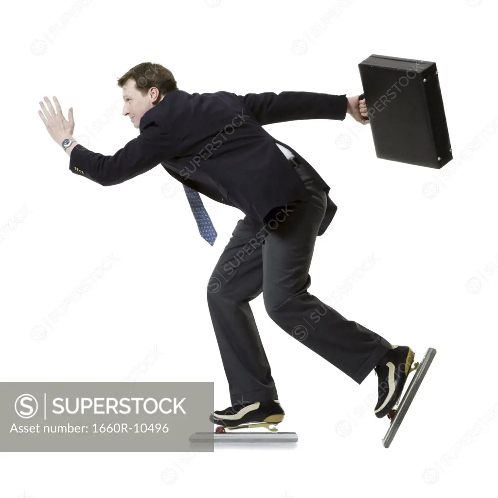 Profile of a businessman ice-skating and holding a briefcase